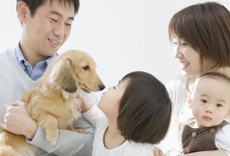 A family with a small dog